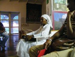 Chenzirah Kahina speaking with a group of women Wednesday for National Women and Girls HIV/AIDS Awareness Day.